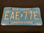 Eae 77E License Plate Nj (new Jersey) Blue Background Stamped Collectible. Fixed Price $13.75.