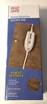 New Drug Mart Deluxe Moist Dry Electric Heating Pad 4 Setting 12X15 9' Cord. Fixed Price $9.99.